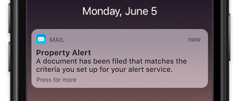 smart phone showing a Property Alert notification