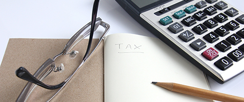 Calculator, notebook, eyeglass and pencil for calculate tax